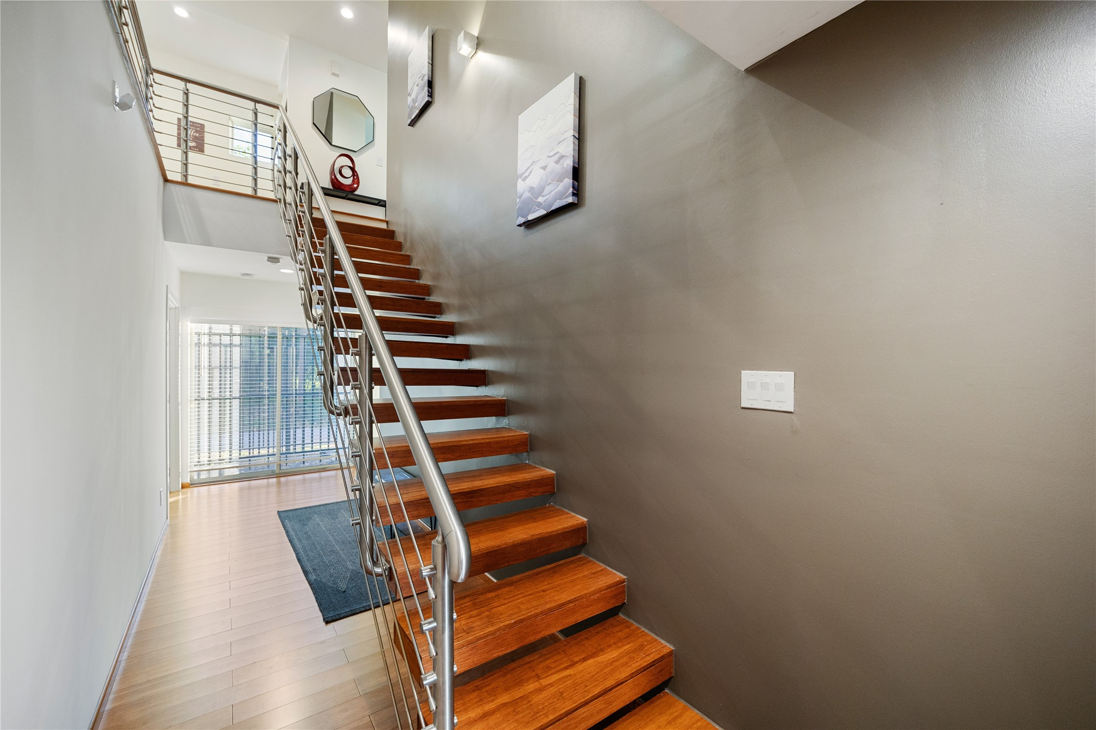 4117 Chartres Street Houston, TX 77004 - Photo 4 of 25 Floating Staircase with contemporary polished metal design finish.