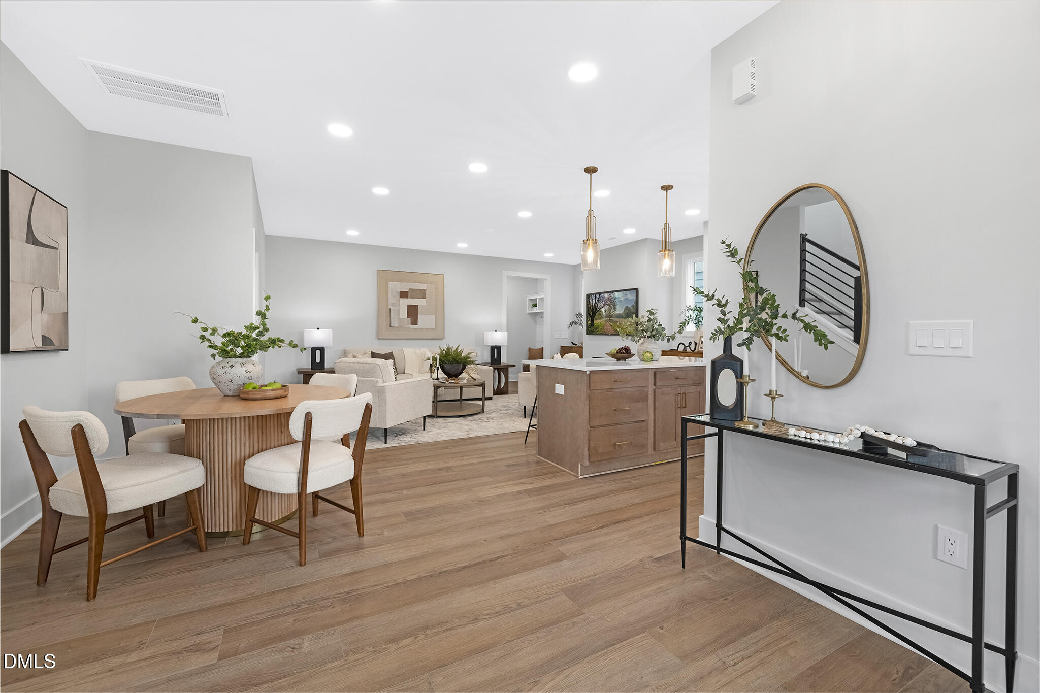 2412 Adrift Road Fuquay-Varina, NC 27526 - Photo 5 of 19 a view of a kitchen with dining table and chairs