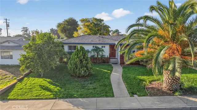 a view of a house with a garden