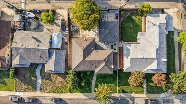 an aerial view of houses with outdoor space