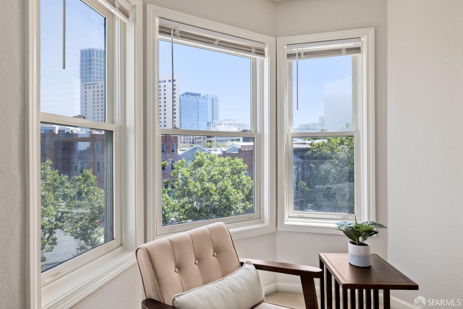 485 8th Street, Unit 402 Oakland, CA 94607 - Photo 11 of 16 a view of a livingroom with furniture and a window