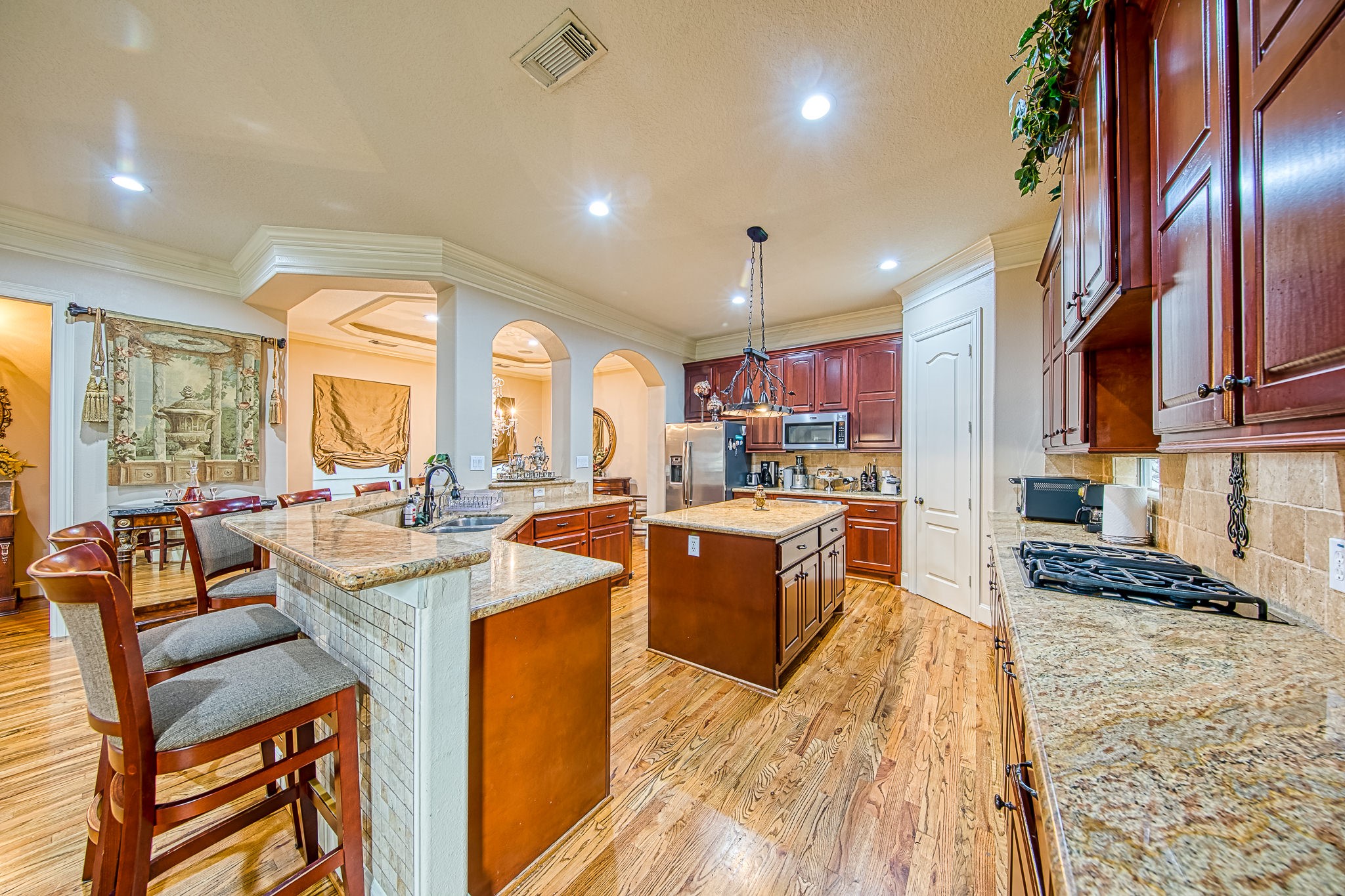 6310 Hamman Street, Unit D Houston, TX 77007 - Photo 16 of 41 a large kitchen with lots of counter space a sink appliances and cabinets