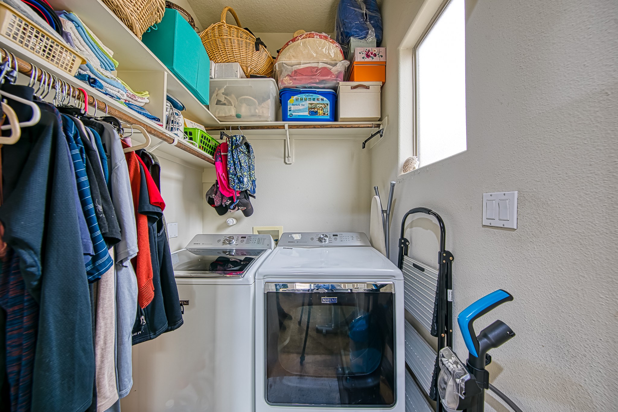 6310 Hamman Street, Unit D Houston, TX 77007 - Photo 28 of 41 a view of walk in closet with clothes and shoes
