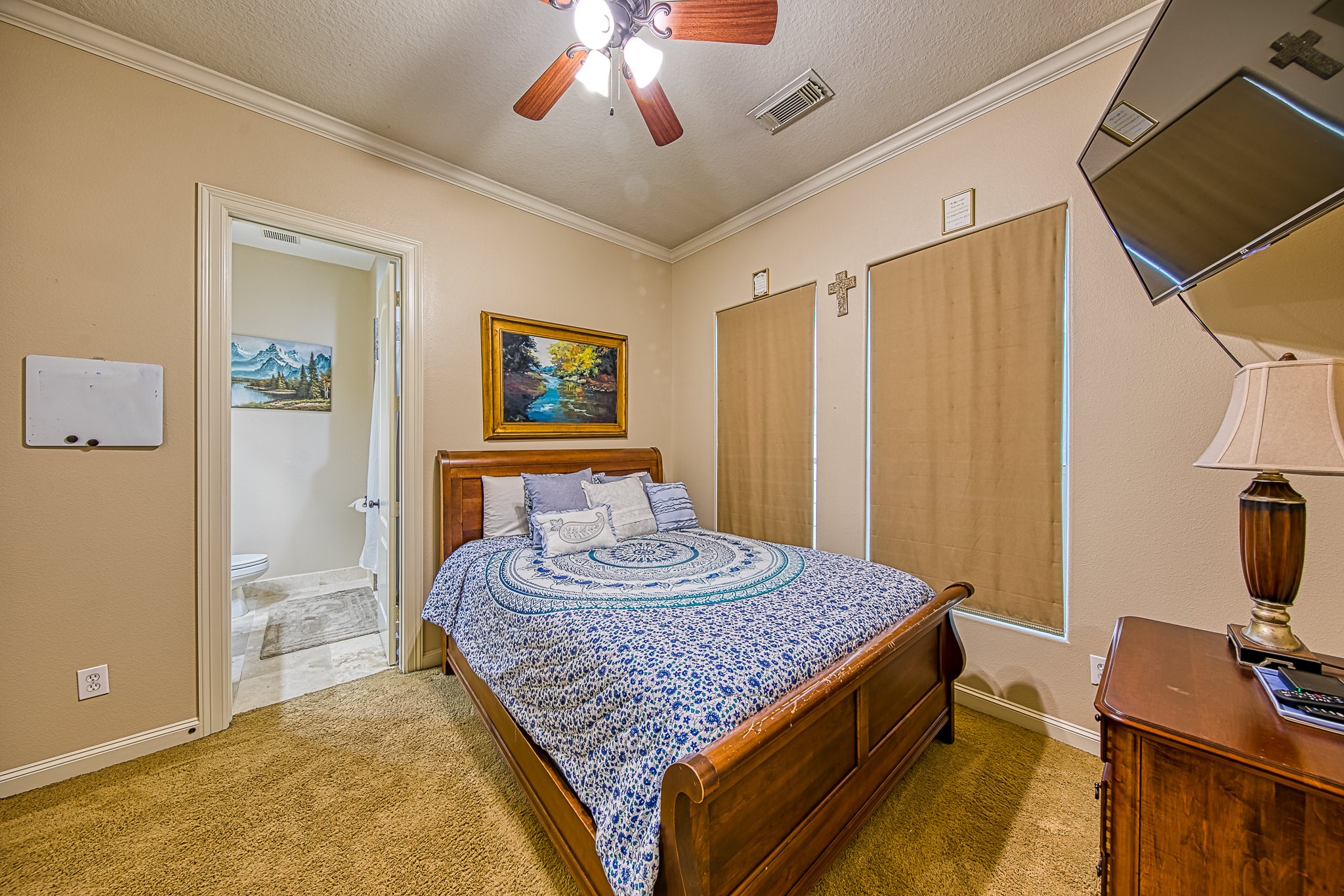 6310 Hamman Street, Unit D Houston, TX 77007 - Photo 30 of 41 a living room with a bed and a chandelier