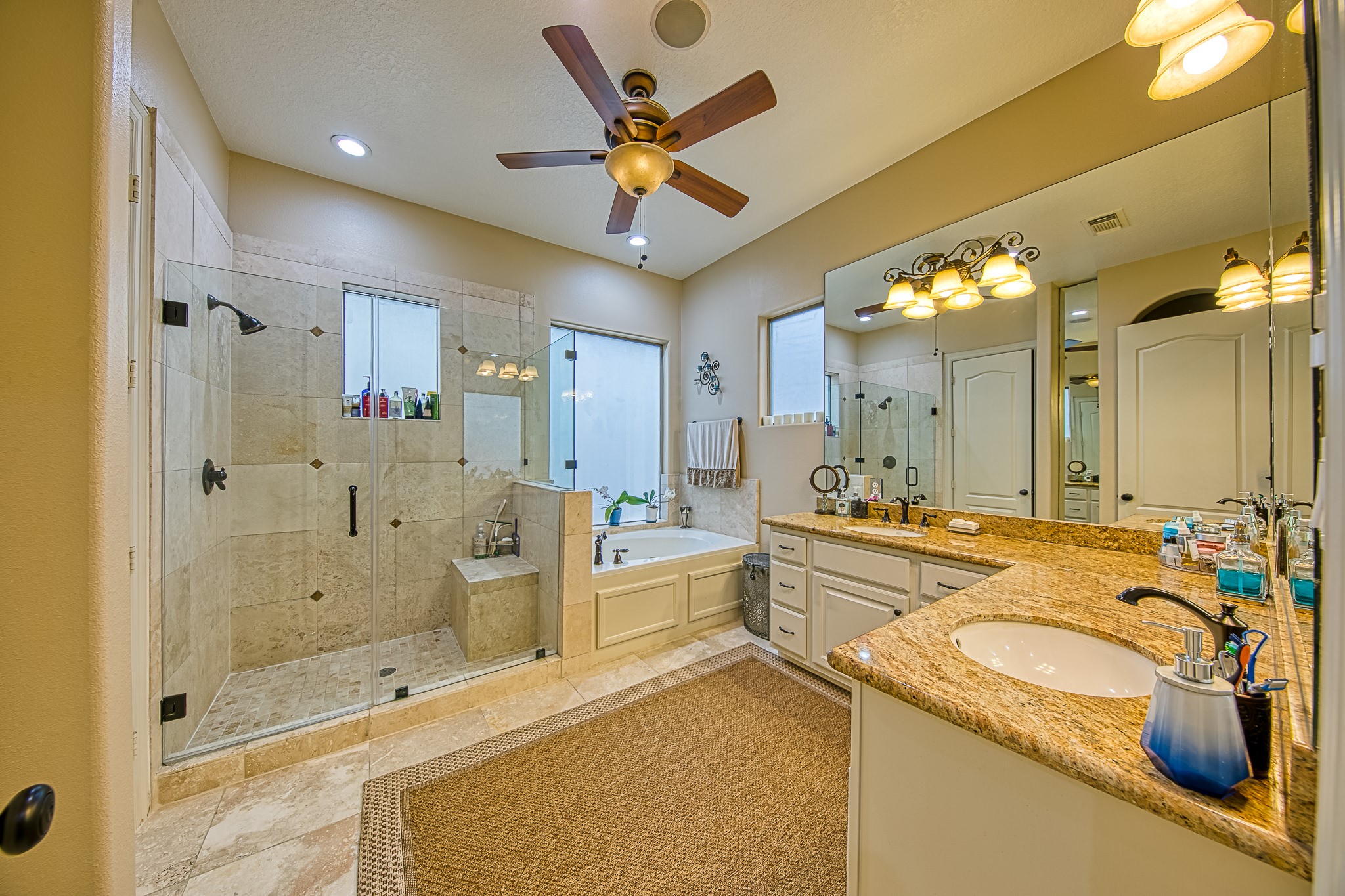 6310 Hamman Street, Unit D Houston, TX 77007 - Photo 37 of 41 a bathroom with a tub sink mirror and shower