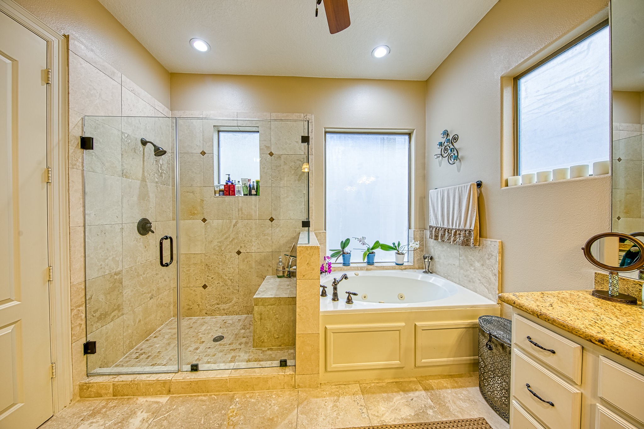 6310 Hamman Street, Unit D Houston, TX 77007 - Photo 40 of 41 a bathroom with a granite countertop tub sink shower and mirror