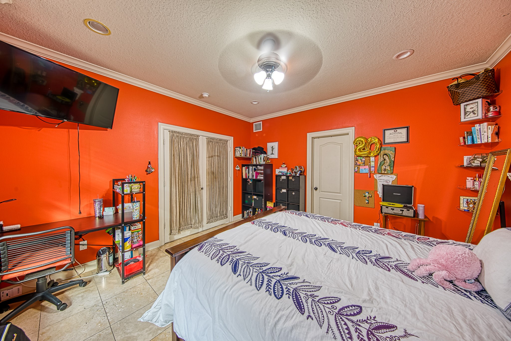 6310 Hamman Street, Unit D Houston, TX 77007 - Photo 8 of 41 a bed room with a bed and a chandelier
