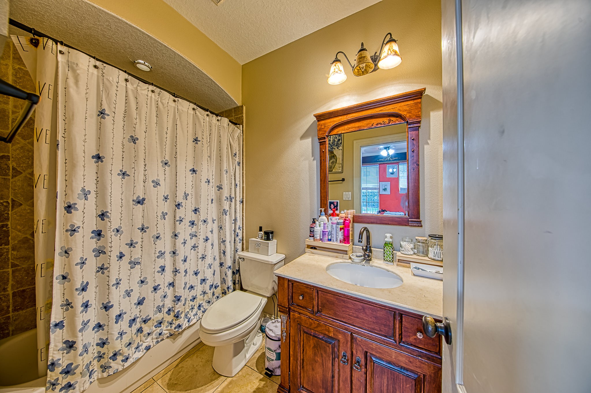 6310 Hamman Street, Unit D Houston, TX 77007 - Photo 9 of 41 a bathroom with a granite countertop sink toilet and shower