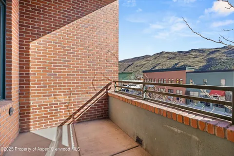 a view of balcony with furniture