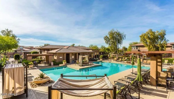a outdoor living space with furniture and flat screen tv