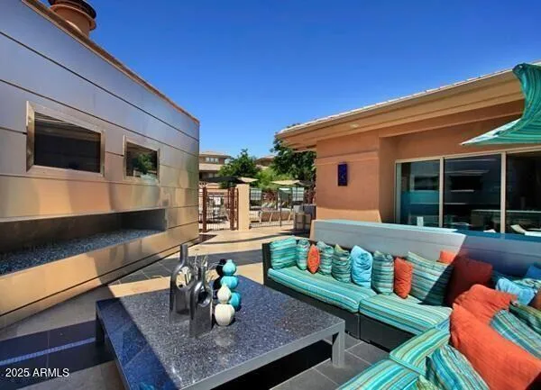 a room with furniture pool table and outdoor seating