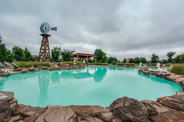 a view of a lake with a house in the background