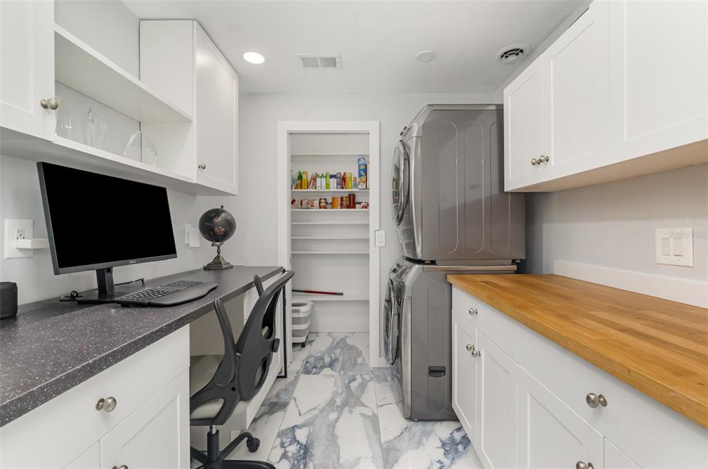 1661 Swan Terrace North Fort Myers, FL 33903 - Photo 20 of 43 a bedroom with a bed and a flat screen tv