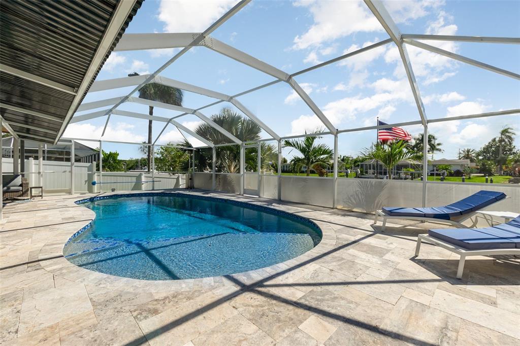 1661 Swan Terrace North Fort Myers, FL 33903 - Photo 30 of 43 a view of a swimming pool with a patio