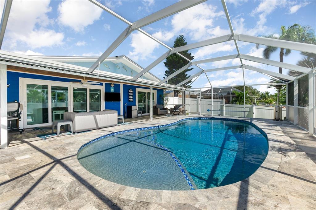 1661 Swan Terrace North Fort Myers, FL 33903 - Photo 31 of 43 a view of a swimming pool with a patio