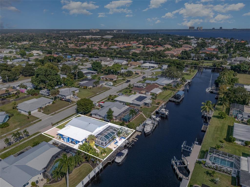 1661 Swan Terrace North Fort Myers, FL 33903 - Photo 40 of 43 an aerial view of residential houses with outdoor space
