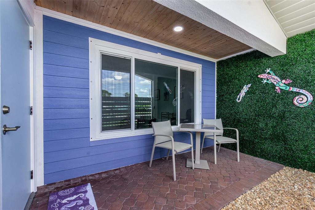 1661 Swan Terrace North Fort Myers, FL 33903 - Photo 7 of 43 a view of a house with backyard sitting area and garden