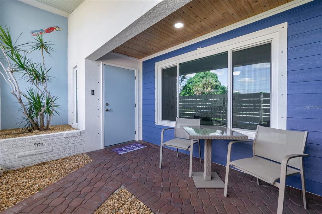 1661 Swan Terrace North Fort Myers, FL 33903 - Photo 8 of 43 a view of a porch with a table and chairs