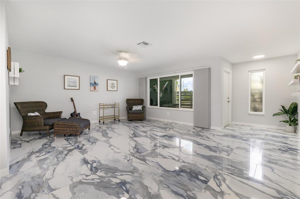 1661 Swan Terrace North Fort Myers, FL 33903 - Photo 10 of 43 a living room with furniture window and a wooden floor