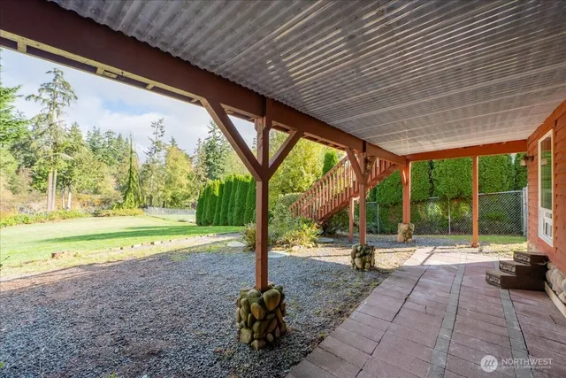 a view of a swimming pool with a patio