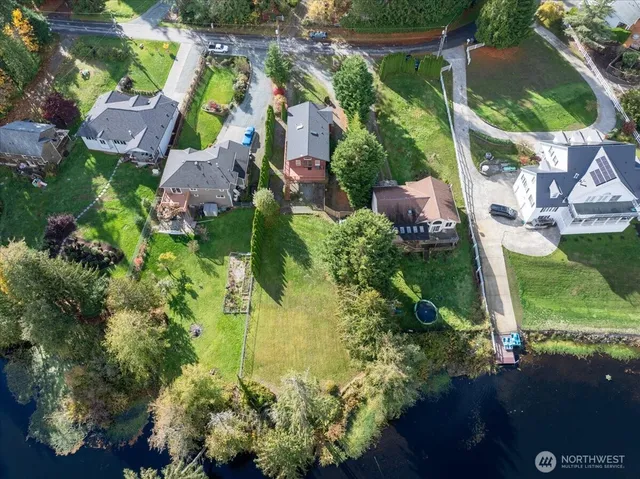 an aerial view of residential building and trees around