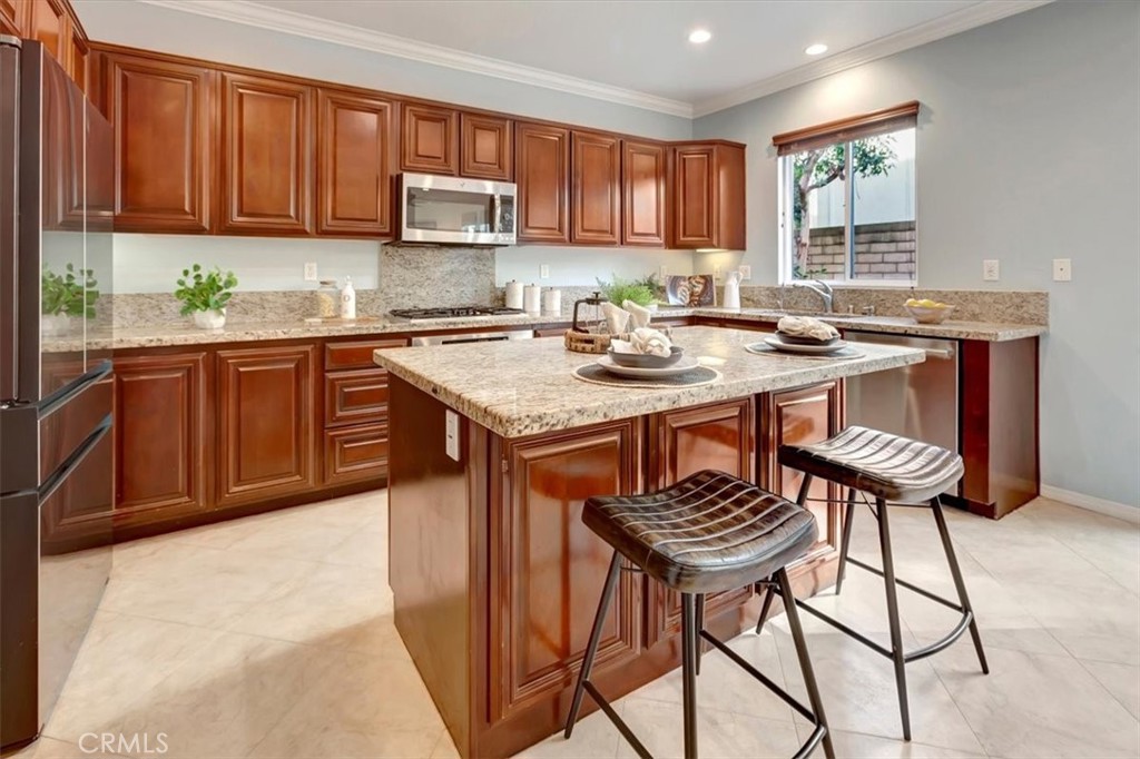 958 Baxter Parkway Brea, CA 92821 - Photo 16 of 50 a kitchen with a sink cabinets and window