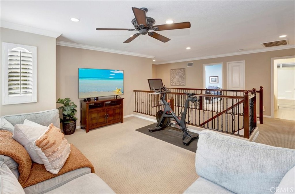 958 Baxter Parkway Brea, CA 92821 - Photo 19 of 50 a living room with furniture ceiling fan and a wooden floor