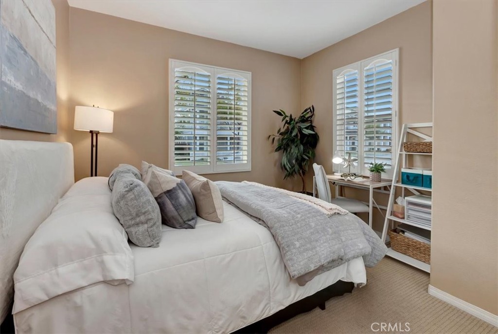 958 Baxter Parkway Brea, CA 92821 - Photo 30 of 50 a bedroom with a bed a lamp and potted plant