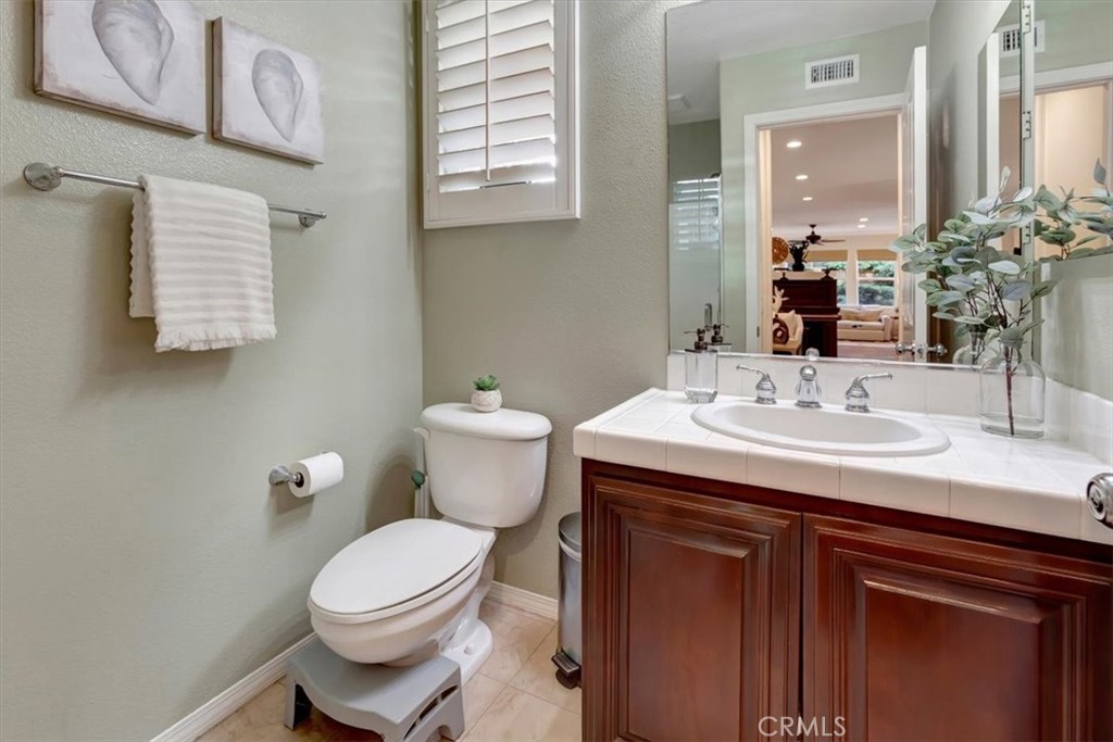 958 Baxter Parkway Brea, CA 92821 - Photo 31 of 50 a bathroom with a sink toilet and mirror