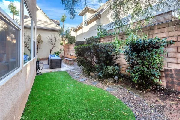 a view of yard with patio