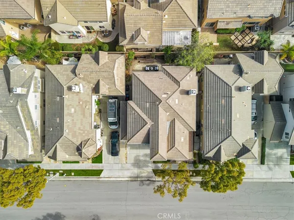 an aerial view of a house with a yard