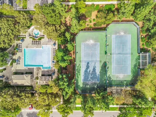 an aerial view of a house with a yard and garden