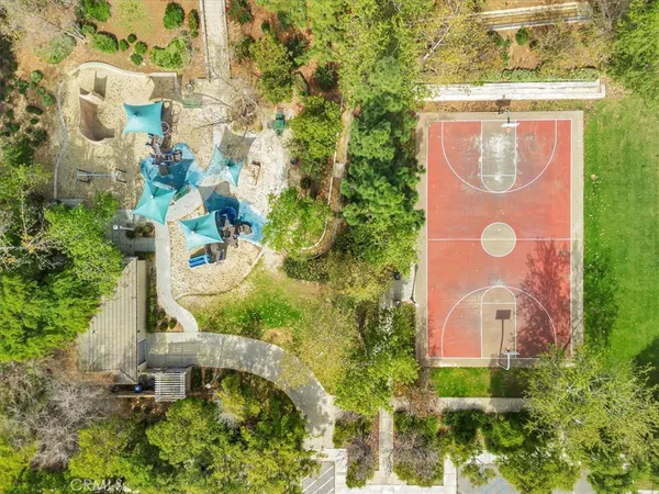 an aerial view of residential houses with outdoor space