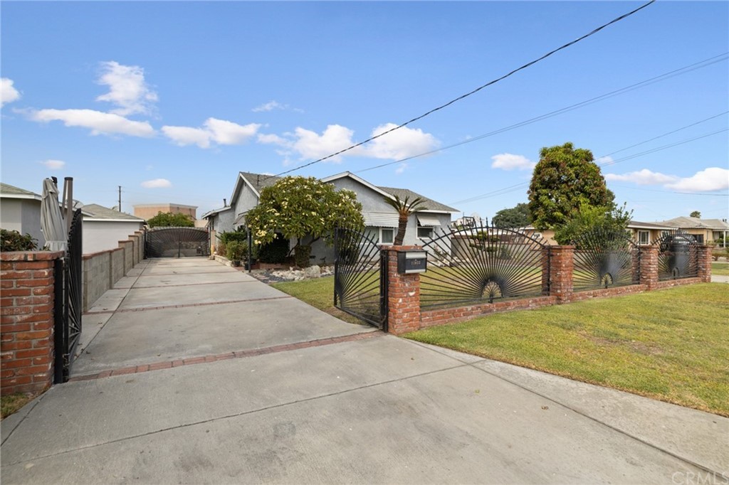 11033 Ranchito Street El Monte, CA 91731 - Photo 1 of 1 Front with driveway and gate