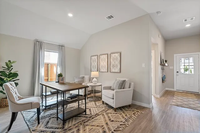 a living room with furniture and a window
