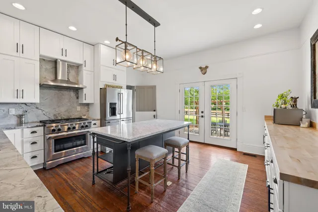 a view of a livingroom with furniture and a fireplace