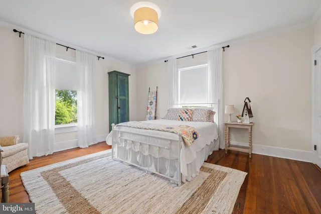 a view of backyard of house with seating space