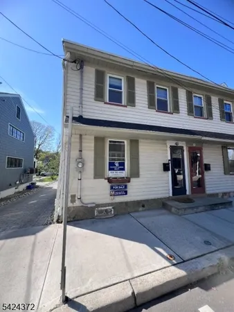 a front view of a house with yard