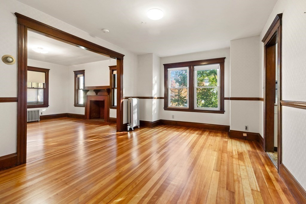 3 Station Road Salem, MA 01970 - Photo 12 of 40 a view of empty room with wooden floor and fan