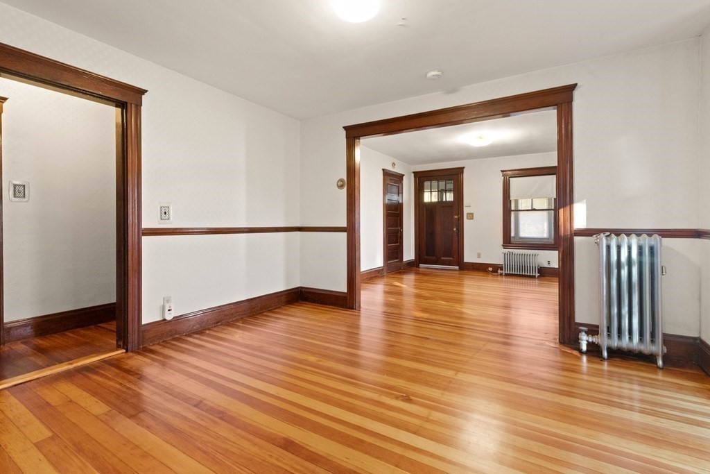 3 Station Road Salem, MA 01970 - Photo 15 of 40 an empty room with wooden floor and a hallway