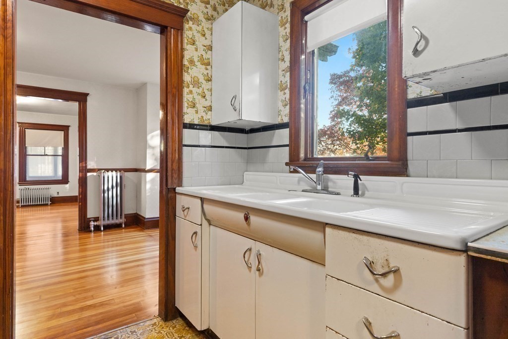 3 Station Road Salem, MA 01970 - Photo 20 of 40 a hallway with a sink and a window