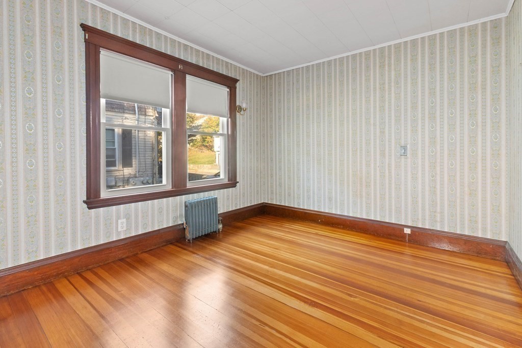 3 Station Road Salem, MA 01970 - Photo 26 of 40 a view of an empty room with wooden floor and a window