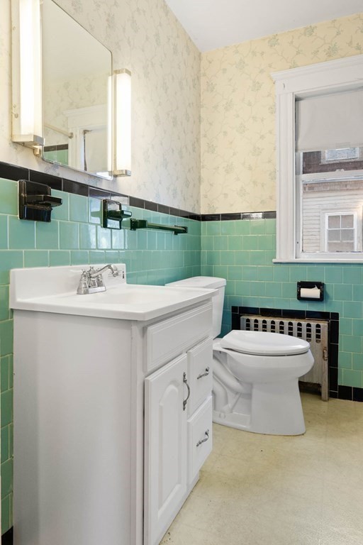 3 Station Road Salem, MA 01970 - Photo 29 of 40 a bathroom with a sink a toilet and mirror