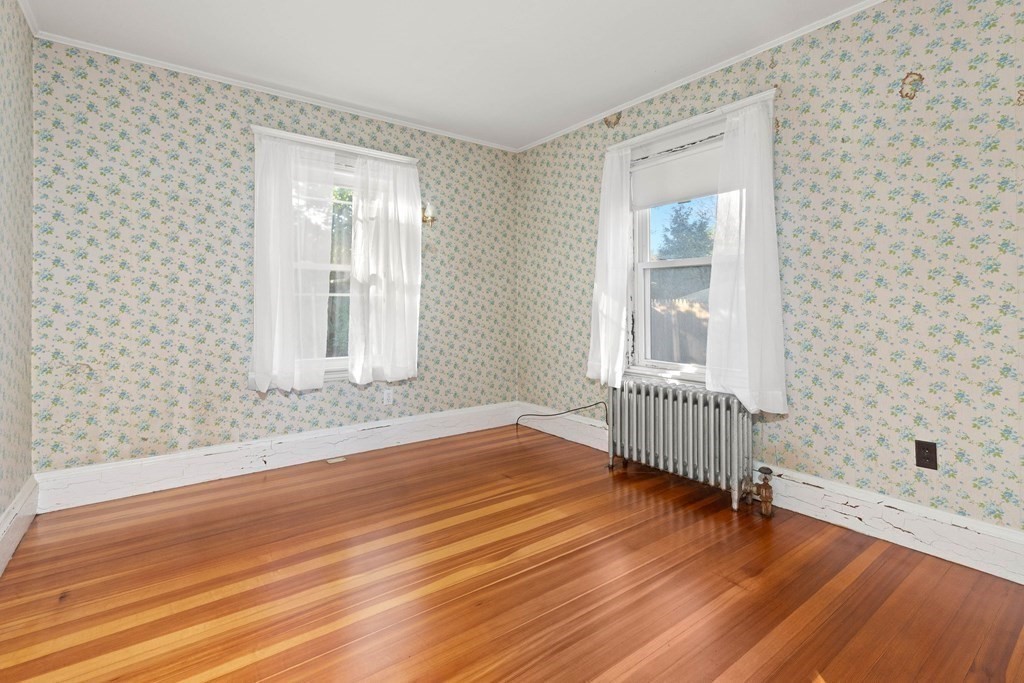 3 Station Road Salem, MA 01970 - Photo 30 of 40 a view of an empty room with wooden floor and a window