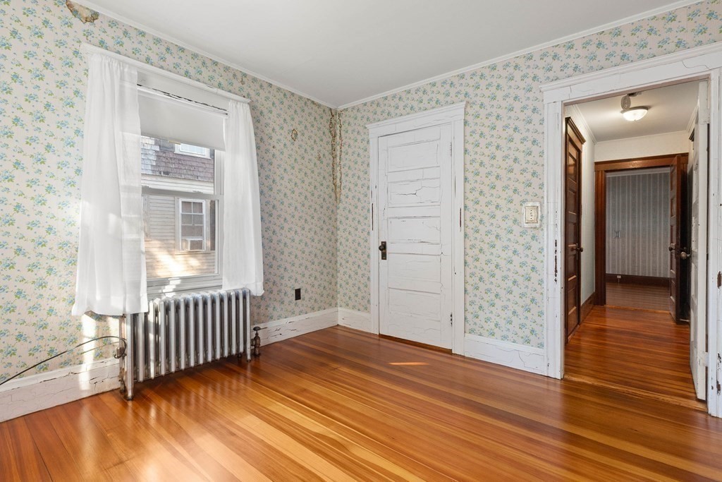 3 Station Road Salem, MA 01970 - Photo 31 of 40 an empty room with wooden floor and windows