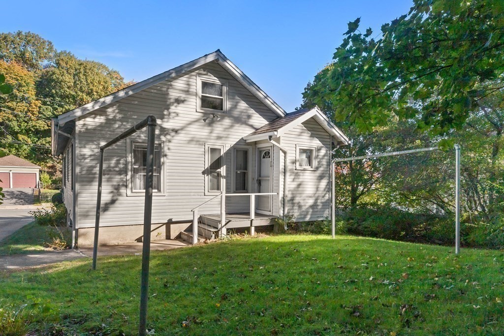 3 Station Road Salem, MA 01970 - Photo 36 of 40 a front view of a house with a yard