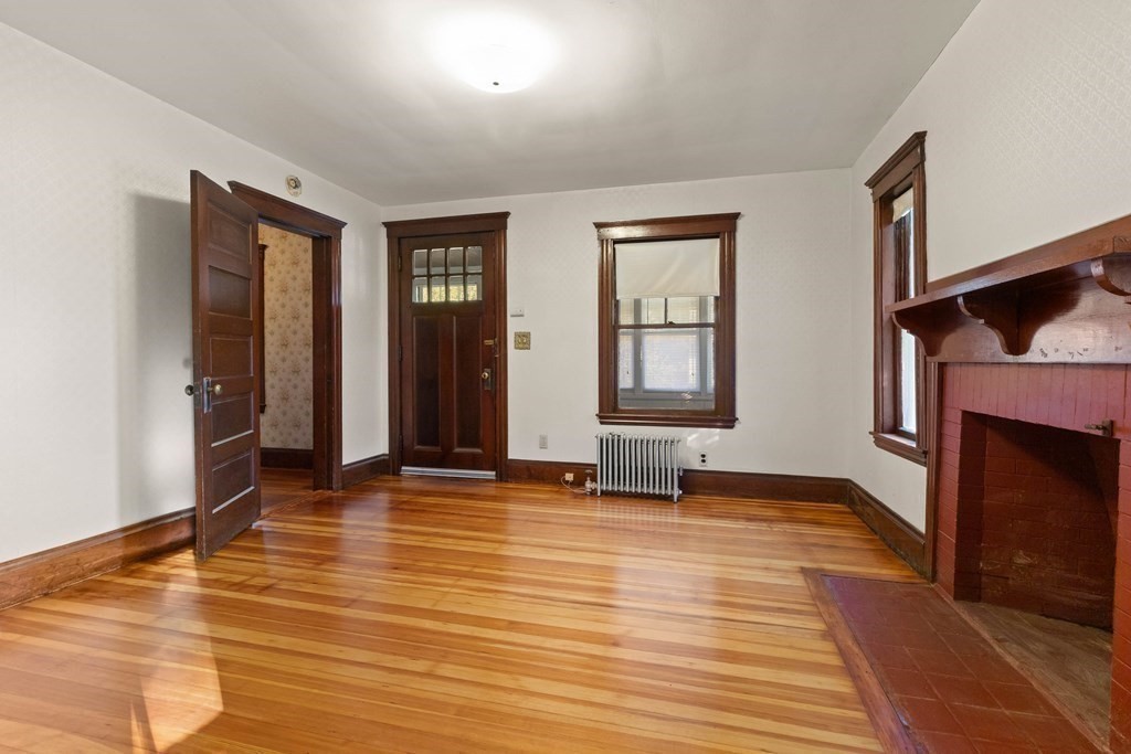 3 Station Road Salem, MA 01970 - Photo 7 of 40 wooden floor fireplace and windows in an empty room