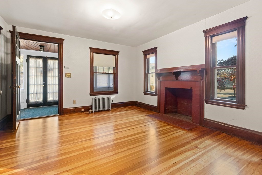 3 Station Road Salem, MA 01970 - Photo 8 of 40 a view of an empty room with window and fire place