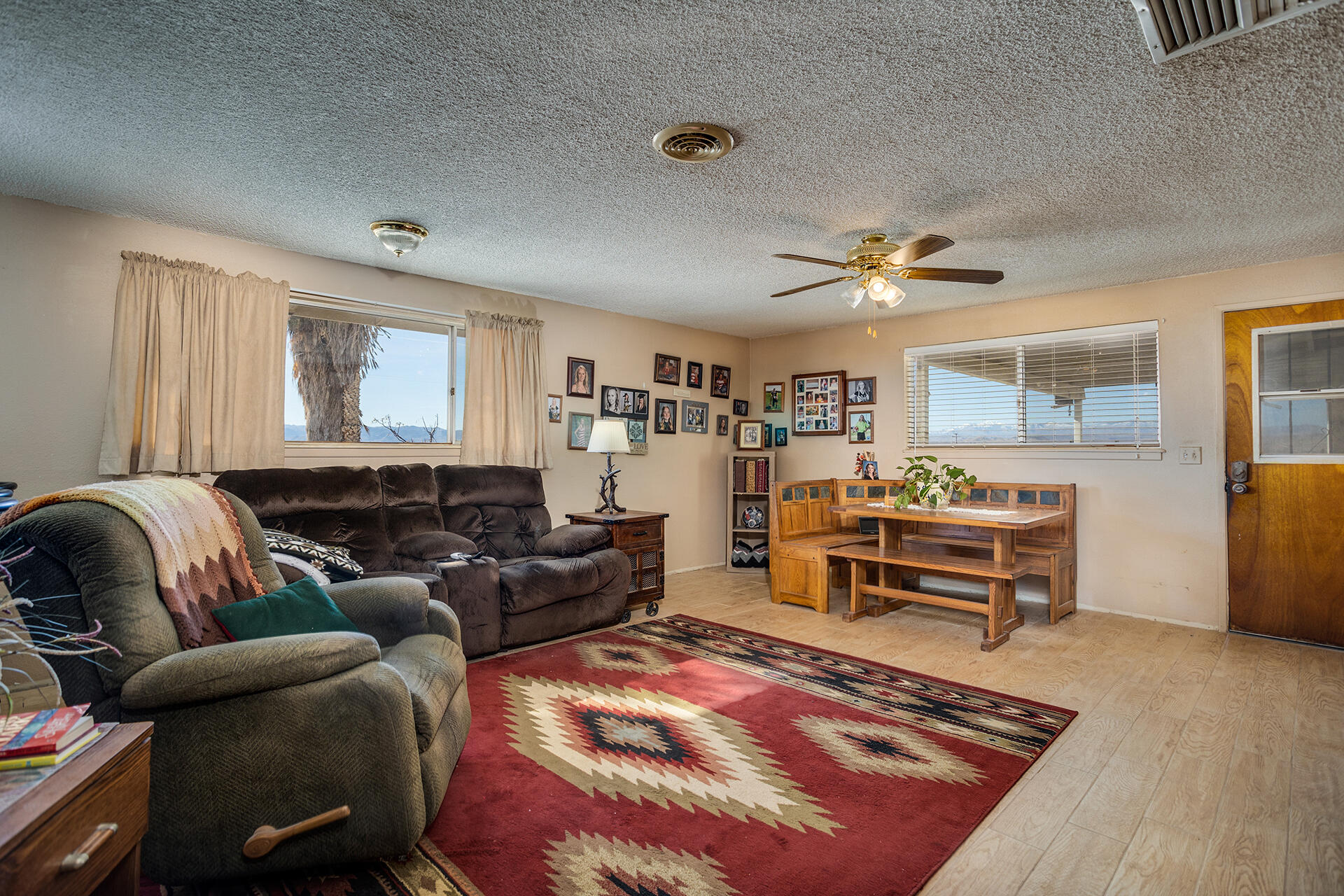 64626 Del Rey Road Joshua Tree, CA 92252 - Photo 14 of 33 a living room with furniture and a wooden floor