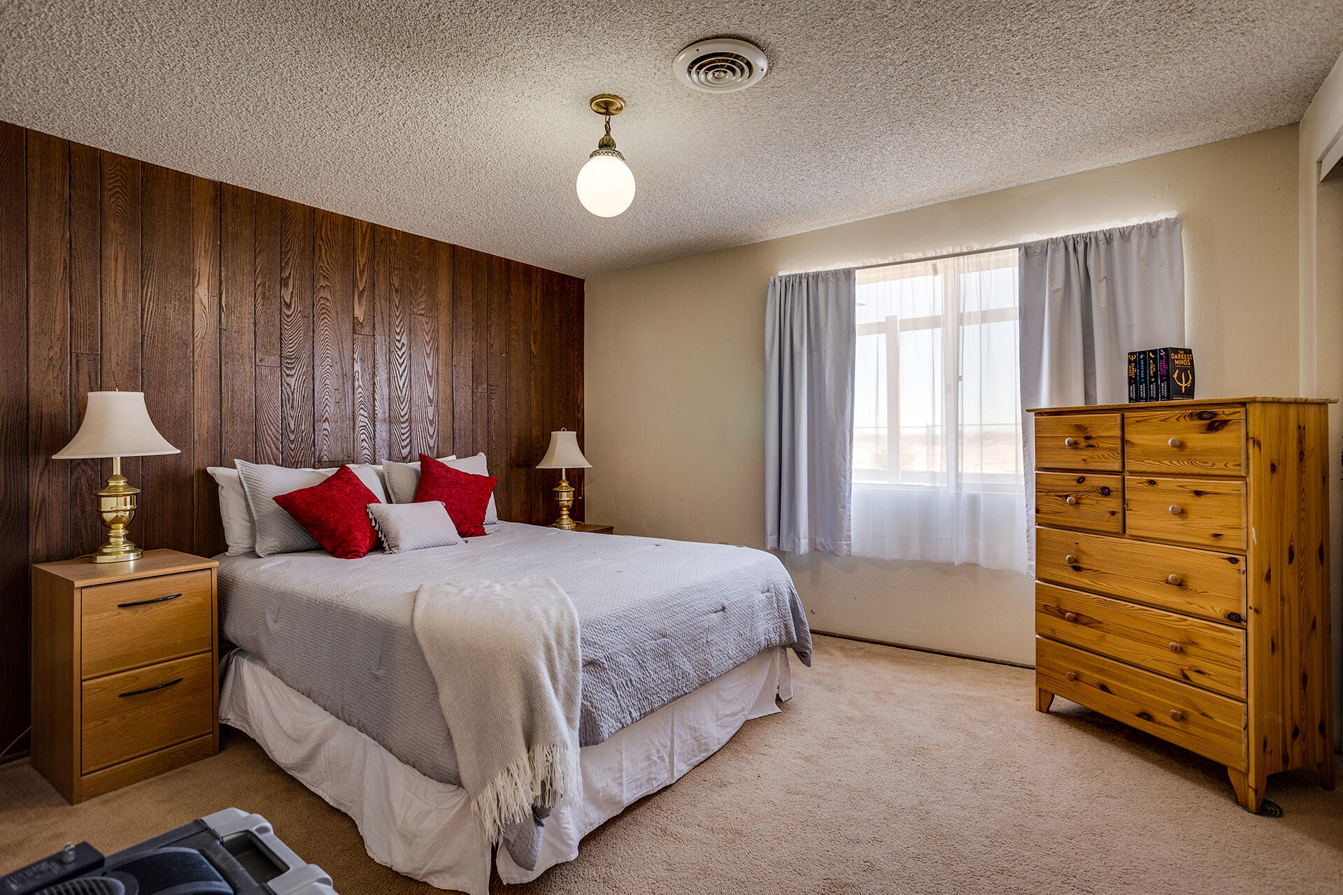 64626 Del Rey Road Joshua Tree, CA 92252 - Photo 18 of 33 a bedroom with a bed and a dresser